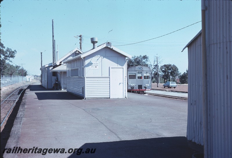 P14323
5 of 6, Station buildings, island passenger platform, end view of diesel railcar, Armadale, SWR line.
