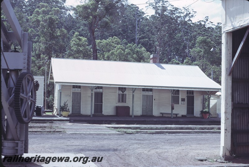 P14359
Station building, front view, platform furniture, edge of crane and goods shed, Pemberton, PP line.
