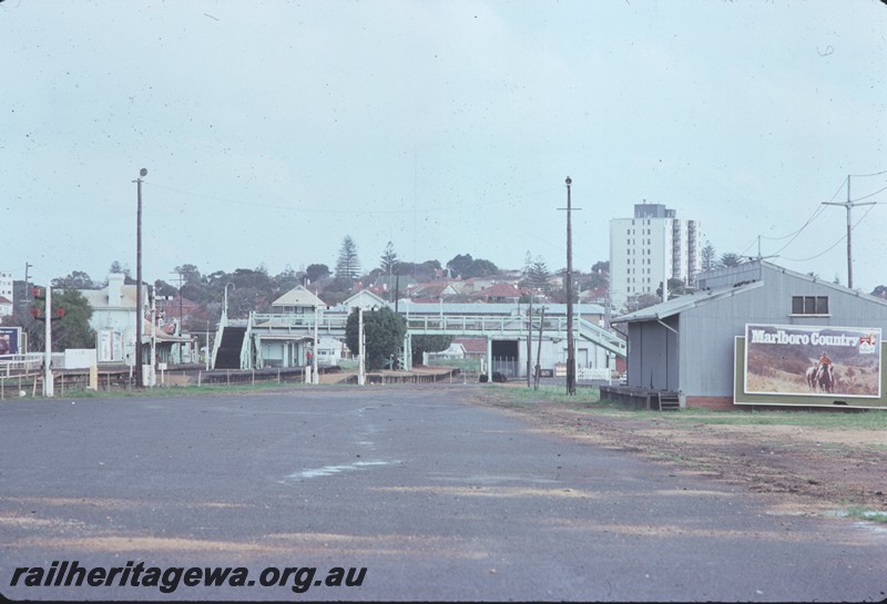 P14390
Station precinct, buildings, footbridge, Claremont, overall view looking west.
