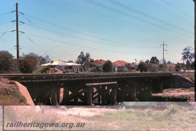 P14433
Trestle bridge, Kenwick, SWR line, shows a horizontal timber to form a span over the water.
