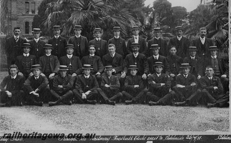 P14459
Kalgoorlie Railway Football Club's visit to Adelaide, group photo taken in Adelaide, all in dress uniform and wearing straw boater hats
