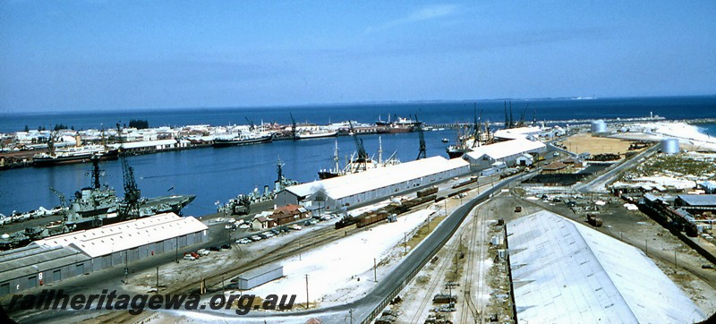 P14466
Harbour, Fremantle, elevated view across the harbour taken from the silos on the North Wharf, shows steam locos shunting on the tracks servicing the wharf
