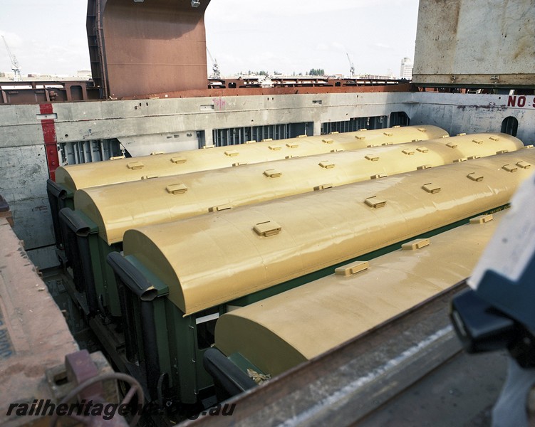 P14479
HVR carriages, four in ship's hold awaiting removal, view looking down into the hold.
