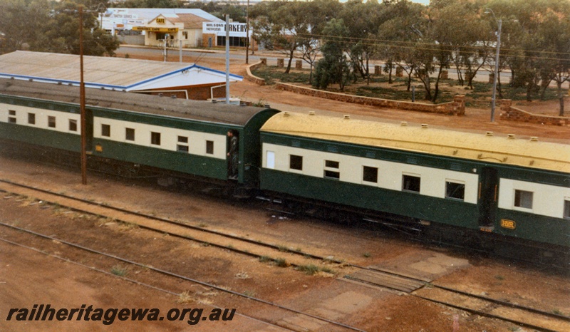 P14515
2 of 4 photos of probably the last military train movement of a unit in Western Australia. 13 field Squadron RAE Army Reserve travelled from Kewdale Yard to Morawa, Photos taken at Morawa, EM line, elevated view across the yard showing two Hotham Valley Railway carnages and the station building behind them.
