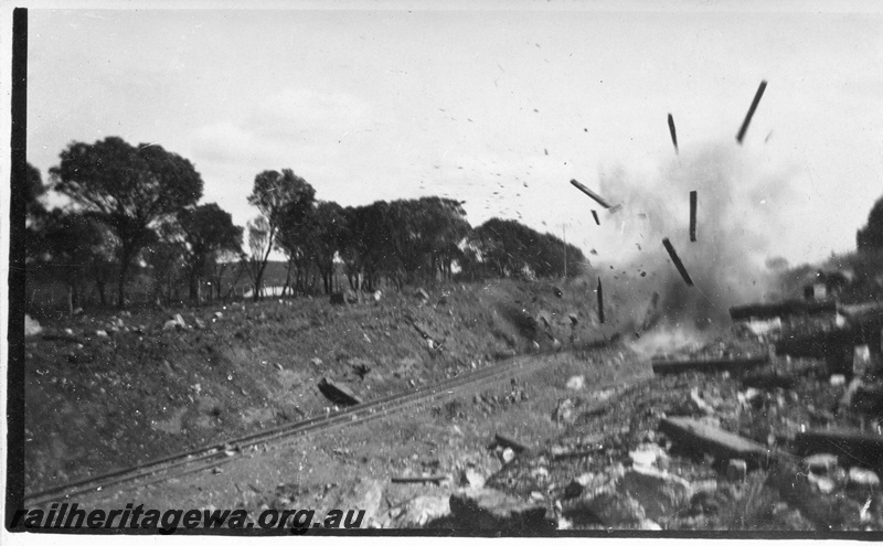 P14521
4 of 5 views of track construction possibly to lower the track through a cutting, further explosion taken place
