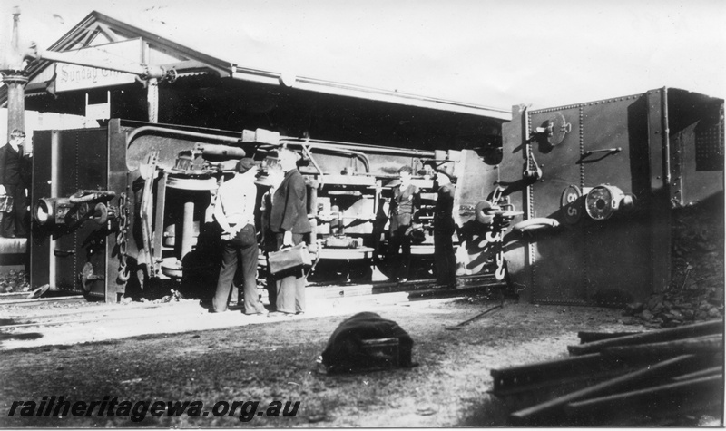 P14526
N class 85 and  N class  203 lying on their sides after a collision at Perth station, end views and underside of the loco.
