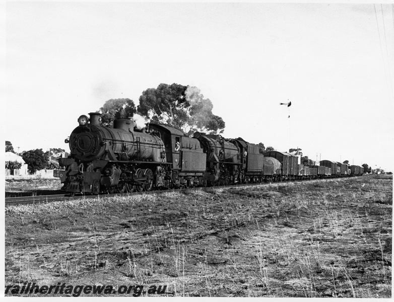 P14646
W class 960 double heading with a V class, distant signal, location Unknown, goods train
