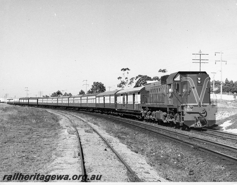 P14677
A class 1511 on a tour train, Bayswater, ER line shows track leading to Brady's Plaster works
