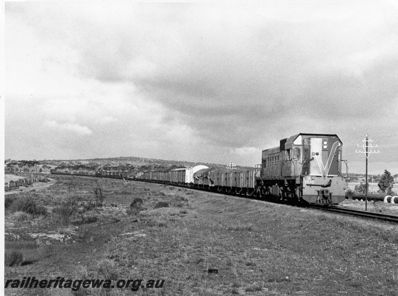 P14683
A class 1510, three arm telegraph pole, location Unknown, goods train
