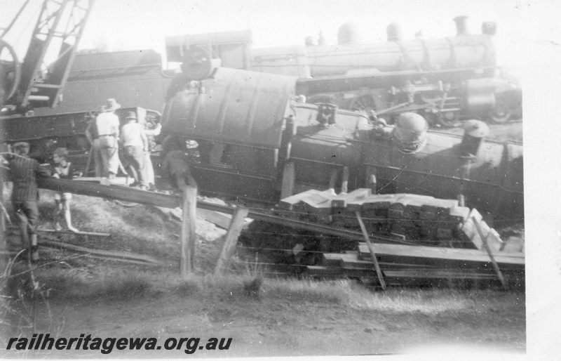 P14689
2 of 10, ES class 332  derailed on 10/6/1951,lying in a creek at Wooroloo, ER line, a PR class loco and a breakdown crane in the background, 
