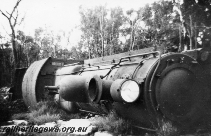 P14701
1 of 3, FS class 427 steam locomotive derailed near Muja on the Muja-Centaur-Collie line, view of loco on its side.
