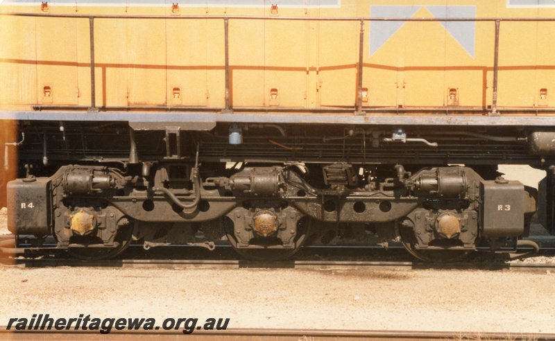 P14739
A class diesel locomotive in Westrail orange livery, side view of bogie.
