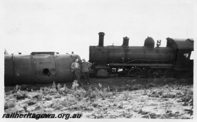 P14742
2 of 3, C class 431 steam loco on AKRU Goods No. 30 derailed near  Gabbin on  21/4/1930,  WLB line, view of the derailed loco and water tanker. 
