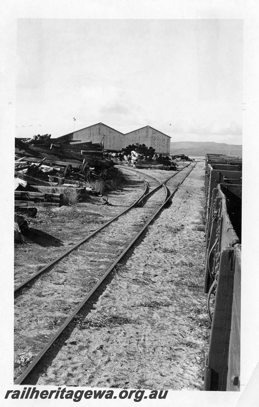 P14786
3 of 4 images of the railway infrastructure at the wharf at Albany, row of wagons on the approach track to the wharf.
