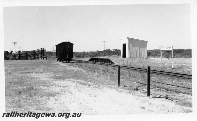 P14793
2 of 2 images of the siding at Cuthbert, GSR line, DC class van, stockyard, platform shed, nameboard, view looking along the siding.
