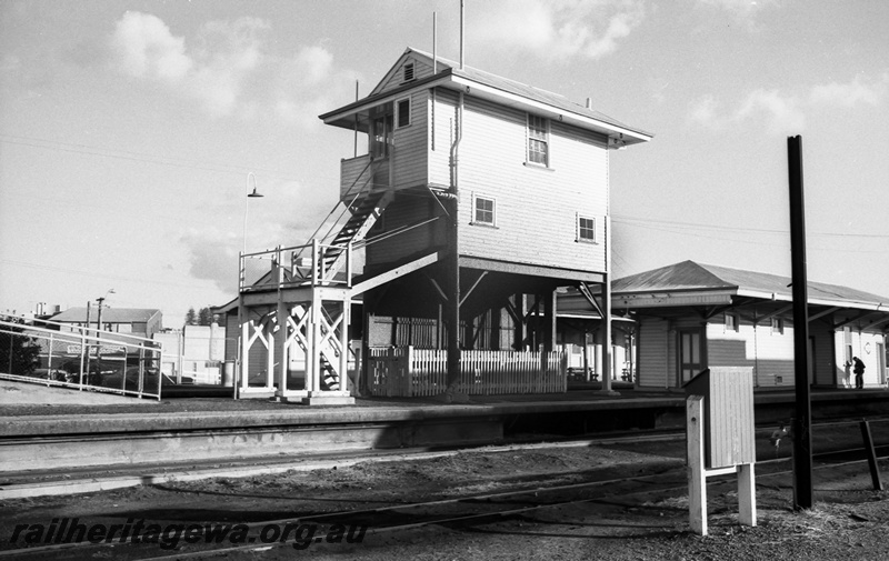 P14806
3 of 21 images of the railway precinct and station buildings at Subiaco, c1969, signal box, island platfrom building, fire hose box, view from the yard looking towards the main platform.
