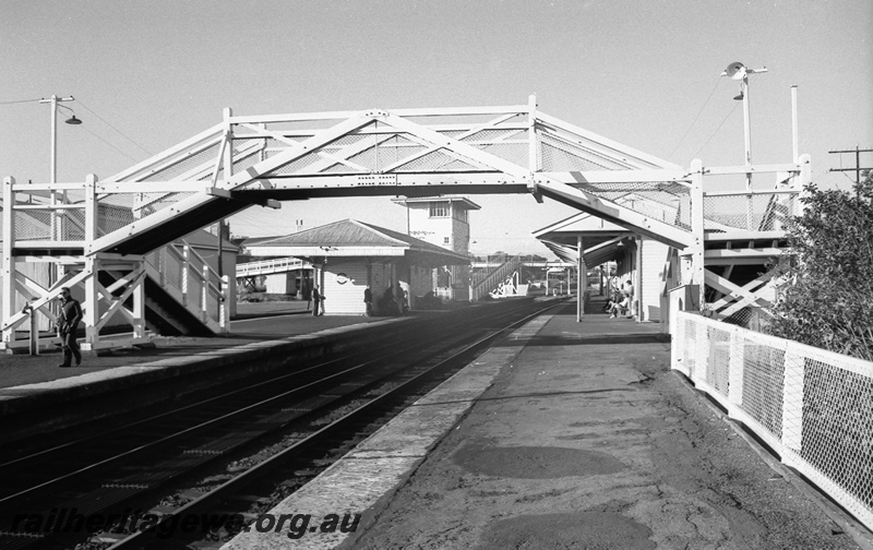 P14811
9 of 21 images of the railway precinct and station buildings at Subiaco, c1969, footbridge, station buildings, signal box, view looking east from west end of the platform
