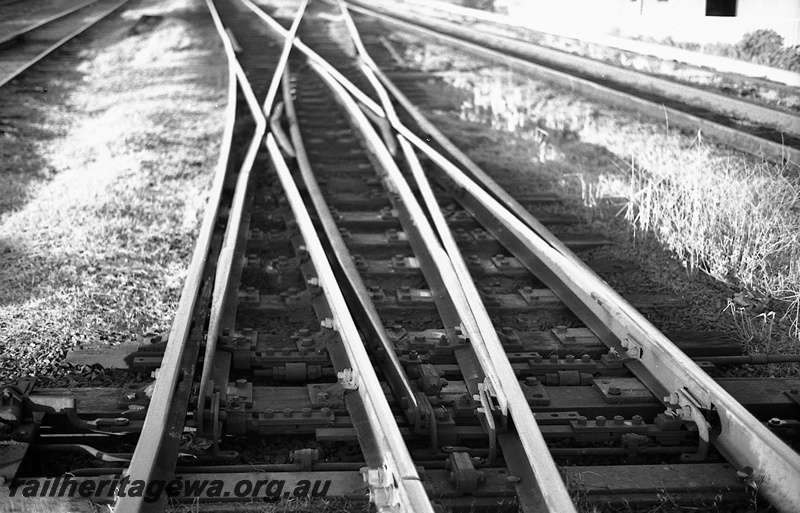 P14821
18 of 21 images of the railway precinct and station buildings at Subiaco, c1969, trackwork, double slip, view looking along the track
