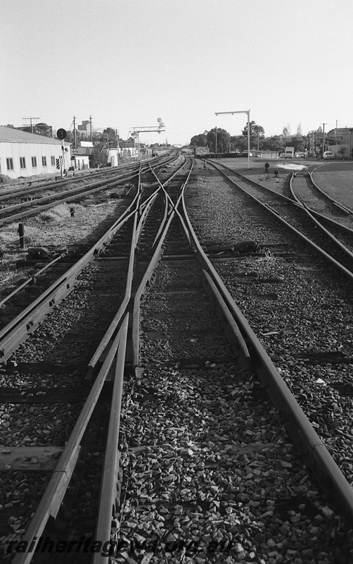 P14822
19 of 21 images of the railway precinct and station buildings at Subiaco, c1969, trackwork, double slip, loading gauge, view along the track
