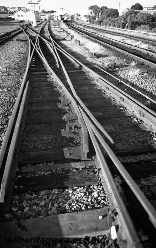 P14823
20 of 21 images of the railway precinct and station buildings at Subiaco, c1969, trackwork, double slip, view along the track
