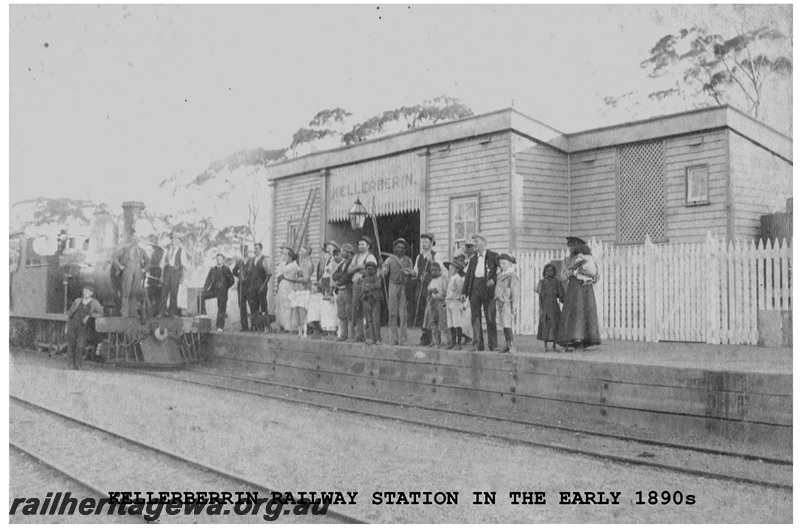 P14849
Station building, trackside view, O class steam locomotive, side and front view, people on the headstock and platform, Kellerberrin, EGR line, early 1890s.
