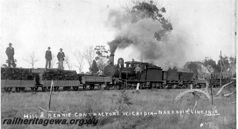 P14850
Rennie & Hill (Hill & Rennie) Contractorsfor the construction of the Wickipin-Narrogin line, NWM line,  G class steam locomotive on work train of sleepers and wooden water tanks, H class 1301 in front of the loco,  ,Mr Richard Rennie on the running board of the loco next to the cab,  men posing on loco and sleepers, view of the train.
