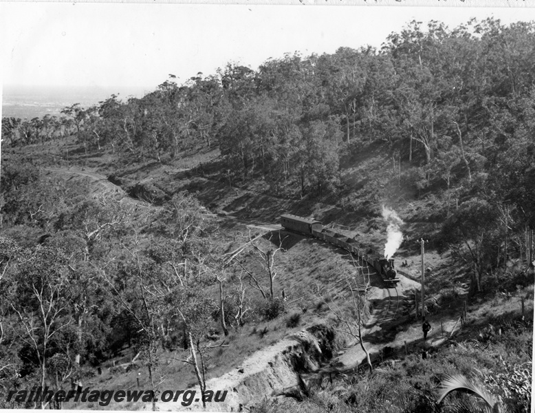 P14877
G class steam locomotive on a mixed train heading to Kalamunda, above the zig zag, UDDR line, elevated view, same as P7682
