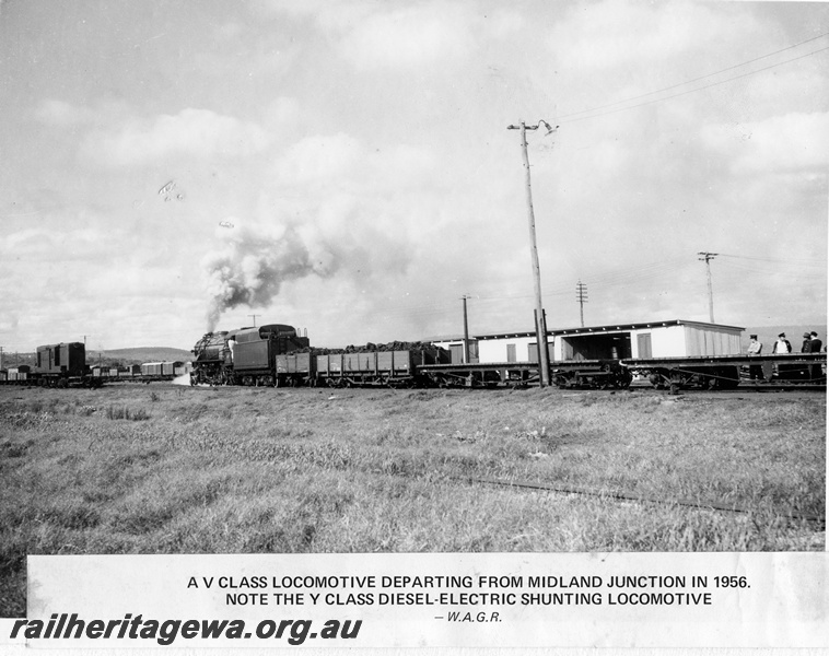 P14885
V class steam locomotive hauling tow wagons of coal and two flat top wagons, heading east, side and end view and Y class diesel shunter in the background, Midland Junction, ER line.
