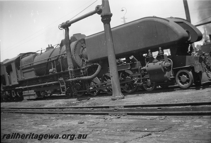 P14900
ASG class 49 Garratt articulated steam locomotive with Cardew cylinder relief valves, side and front view, at water column, East Perth, ER line, c1950.
