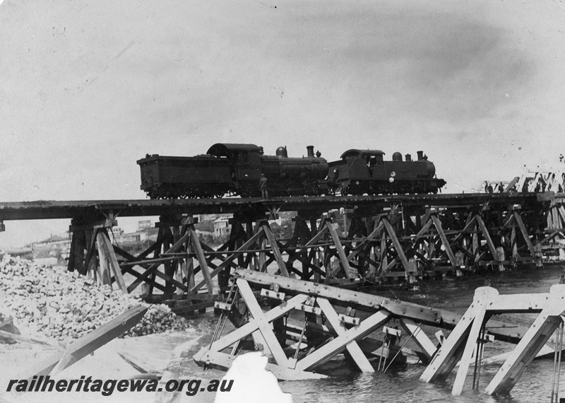 P14913
F class steam loco, D class 380 driven by Archie McCullum, trestle bridge over the Swan River at Fremantle, testing the repaired bridge after being flood damaged

