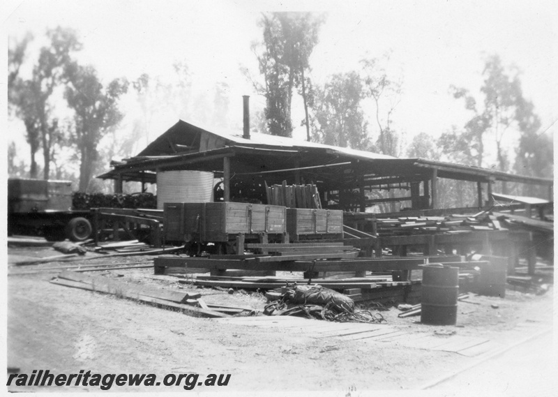 P14940
The mill buildings at Tullis with two GC class wagons on a track leading into the mill
