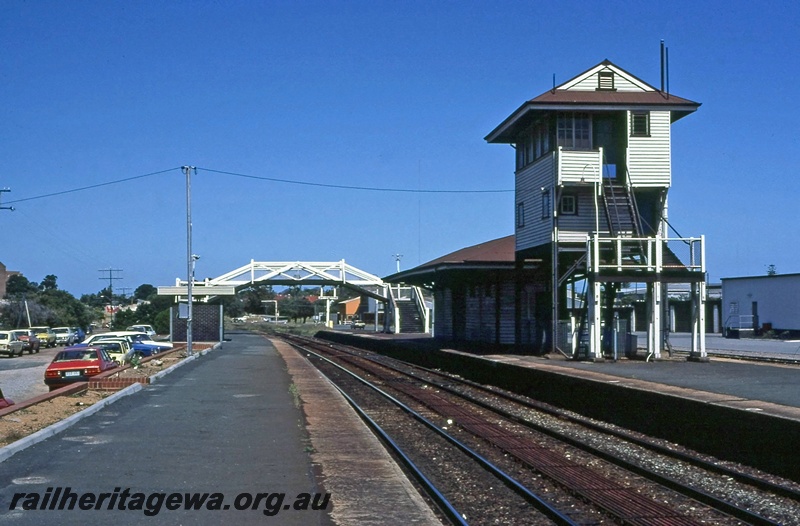 P14947
Signal box, wooden footbridge, island station building, Subiaco view along the platform looking west
