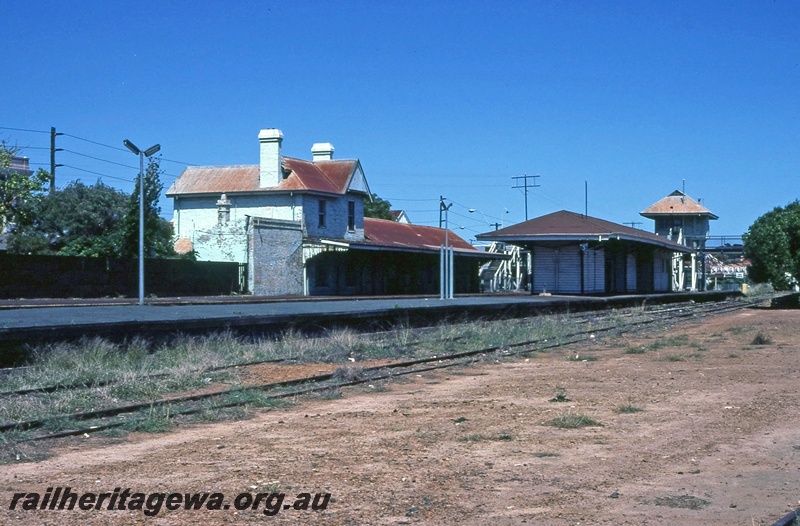 P14948
Station buildings, elevated signal box, Claremont, view from across the tracks looking down the platforms
