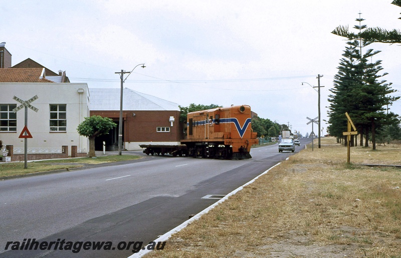P14950
Y class 1103, straddling the road alongside, shunting the Thomas Flour Mill in Cottesloe. 
