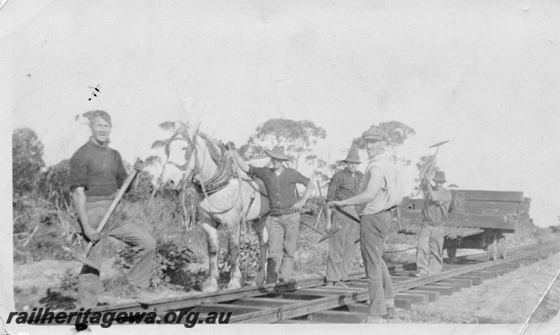 P14971
The four enterers & the trolley driver and horse. The bend is the finish of a ten mile straight run.
