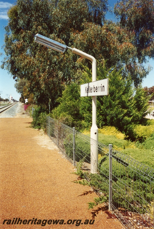 P14996
Station light and nameboard, Kellerberrin, standard gauge line, v view along the platform
