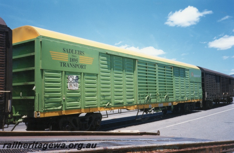 P15014
RLSY class 18749 standard gauge bogie van in Sadleir's green livery, Sadleir's depot, Kewdale, end and side view.
