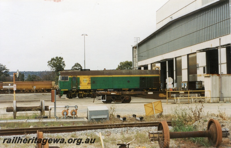 P15017
NJ class 5 in the green with a yellow panel livery, Forrestfield, side view 
