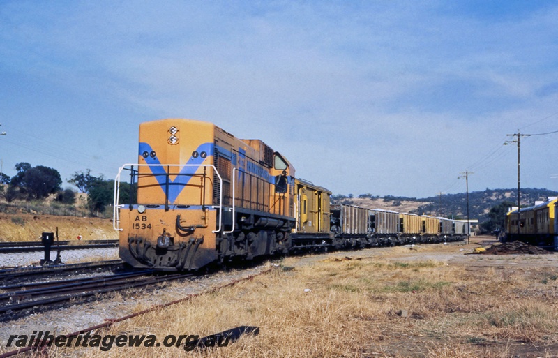 P15026
AB class 1534 in Westrail orange livery without the white pin strip, hauling ballast train, Toodyay West, Avon Valley line
