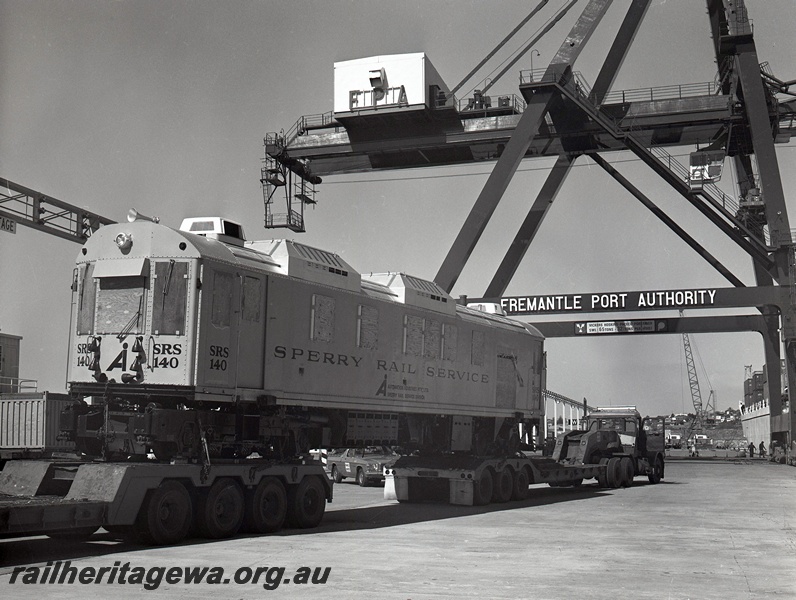 P15050
Sperry Rail Service railcar 140, on road transport trailer, Fremantle Port Authority crane,12 Berth, North Quay, Fremantle Port, end and side view
