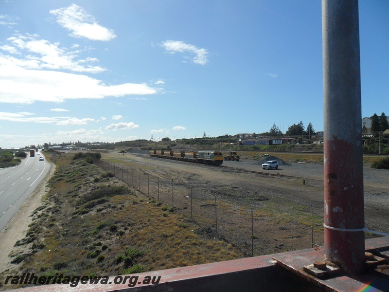 P15064
1 of 7 views of the yard at Leighton showing the changes that have taken place to the trackwork and the infrastructure within the yard. PTA loco U class 201 with ballast hoppers, general view of the yard looking north from the footbridge
