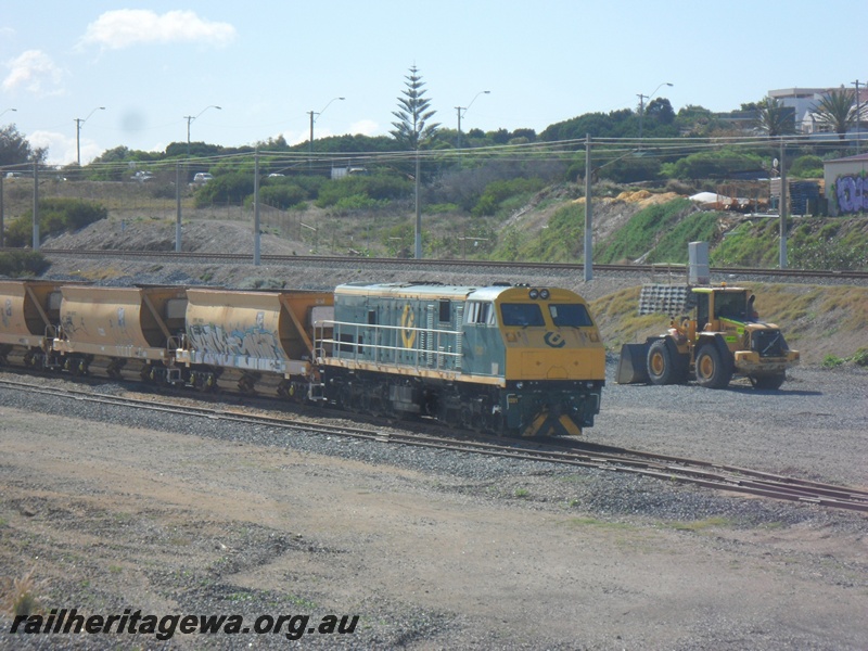 P15065
2 of 7 views of the yard at Leighton showing the changes that have taken place to the trackwork and the infrastructure within the yard. PTA loco U class 201 with XM class ballast hoppers standing on the new loop.
