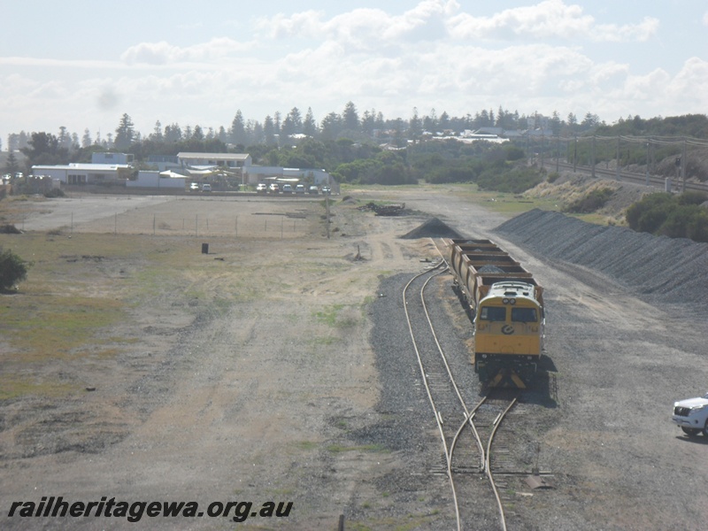 P15069
6 of 7 views of the yard at Leighton showing the changes that have taken place to the trackwork and the infrastructure within the yard. PTA loco U class 201 with XM class ballast hoppers standing on the new loop, northerly elevated view of the yard. 
