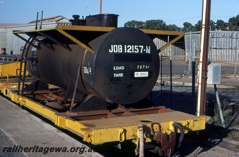 P15096
JOB class 12157 bogie flat fitted with a former fuel tank wagon. 
