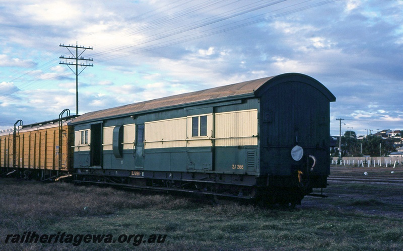 P15101
ZJ class 433 passenger brakevan, painted in passenger green and cream, situated at the end of a freight train. .
