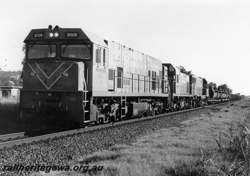 P15106
P class 2009 leads an AB class and a DA class locomotive near Millendon, MR line, hauling a goods train to Geraldton

