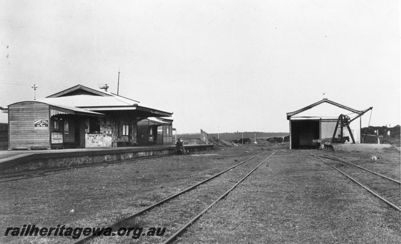 P15108
Traffic Office, Ladies Waiting Room and other buildings on the platform, derrick platform crane,  goods shed 2nd Class with loading platform,  note the length runner's trike at the platform. Northampton, GA line.
