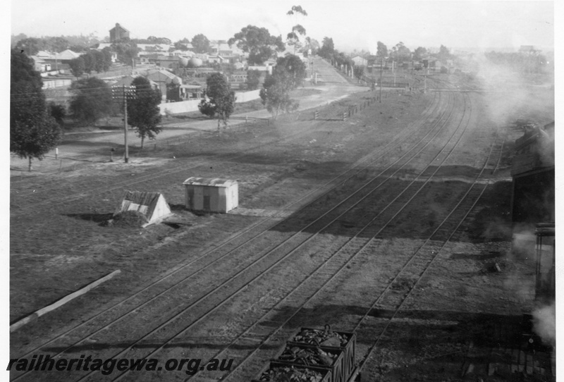 P15125
Katanning station yard and town as viewed from the coal stage at Loco depot. GSR line. Note main/branch line trackage, and gang shed on left.
