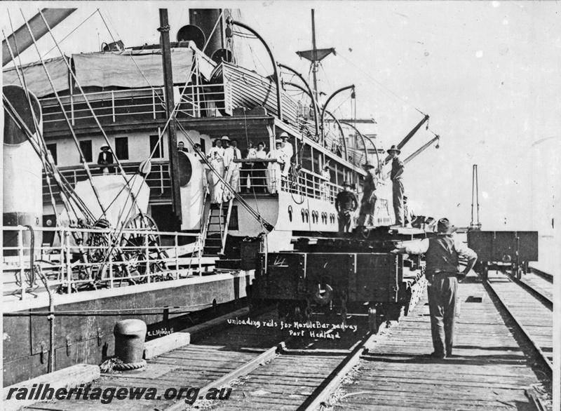 P15129
H class wagon, State Ship tied up at the jetty, Port Hedland, PM line, unloading rails for the 