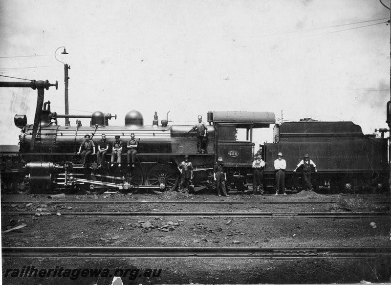 P15133
P class 456 at an Unknown location with several workmen standing on the side of the locomotive and 4 sitting on the running board, water column, goose neck yard light.
